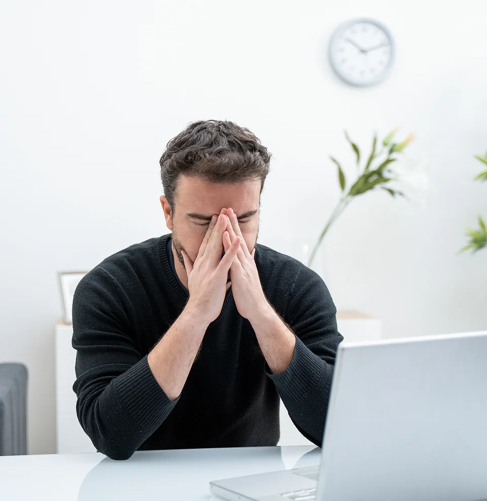 job seeker hands in head